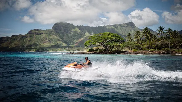 Water sports on Waikiki Beach: surf, outrigger canoe, and paddle